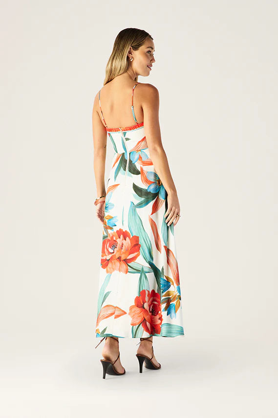 Woman wearing a floral dress with a white background