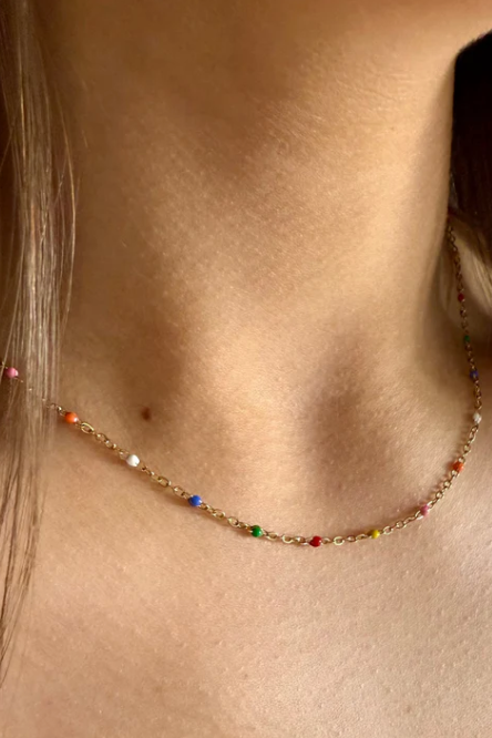 Necklace with colorful beads on a person's neck